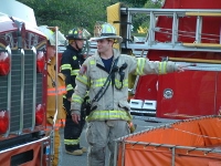 Firefighter and fire trucks